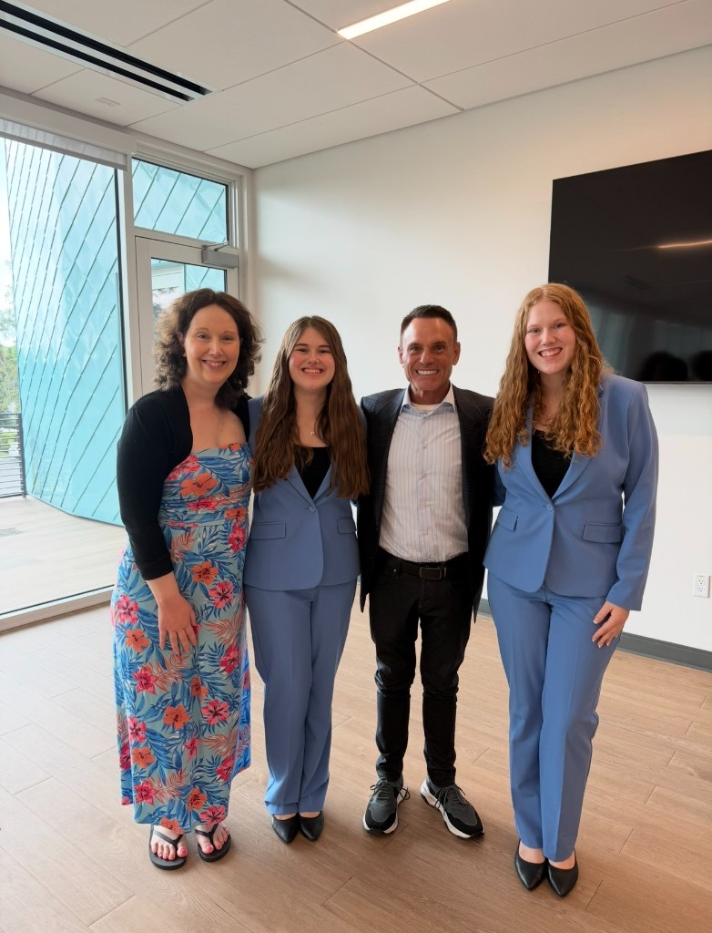Katelyn and Kaleigh with their mother and Kevin Harrington after the spARK Labs pitch in St. Petersburg.